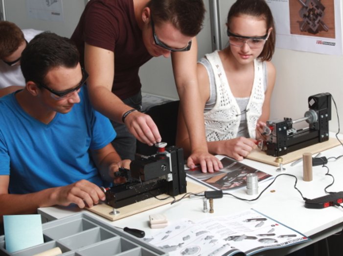 Students working together on the UNIMAT lathe