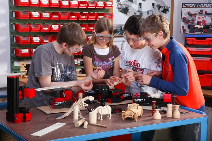 Students work with UNIMAT machines