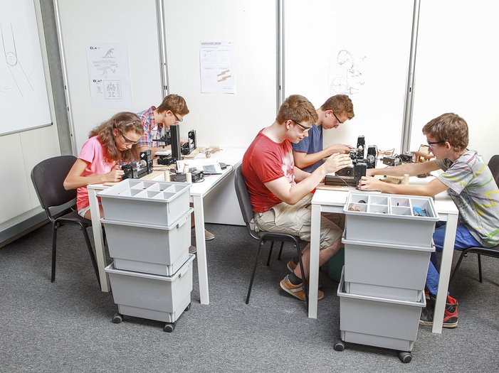 students working in a classroom with unimat machines