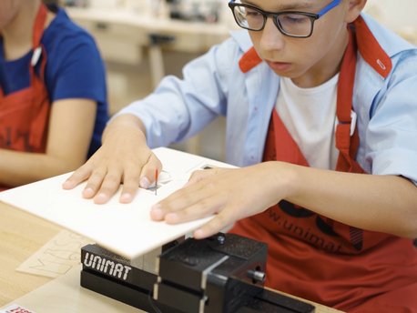 Students cutting wood with the UNIMAT jig saw